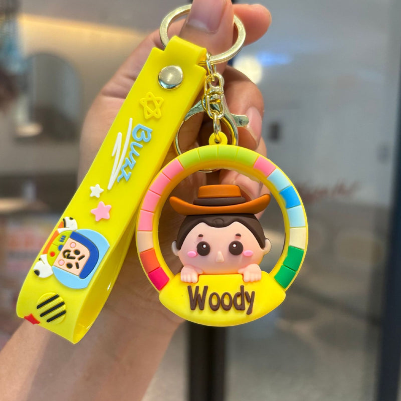 Yellow cowboy cartoon rubber pendant keychain with colorful frame and matching strap