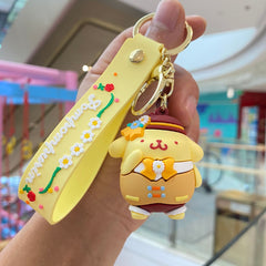 Yellow floral 3D character keychain with gold-tone ring